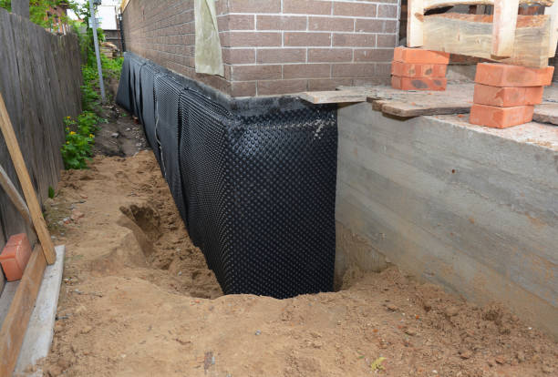 Happy homeowners after waterproofing job in Denver